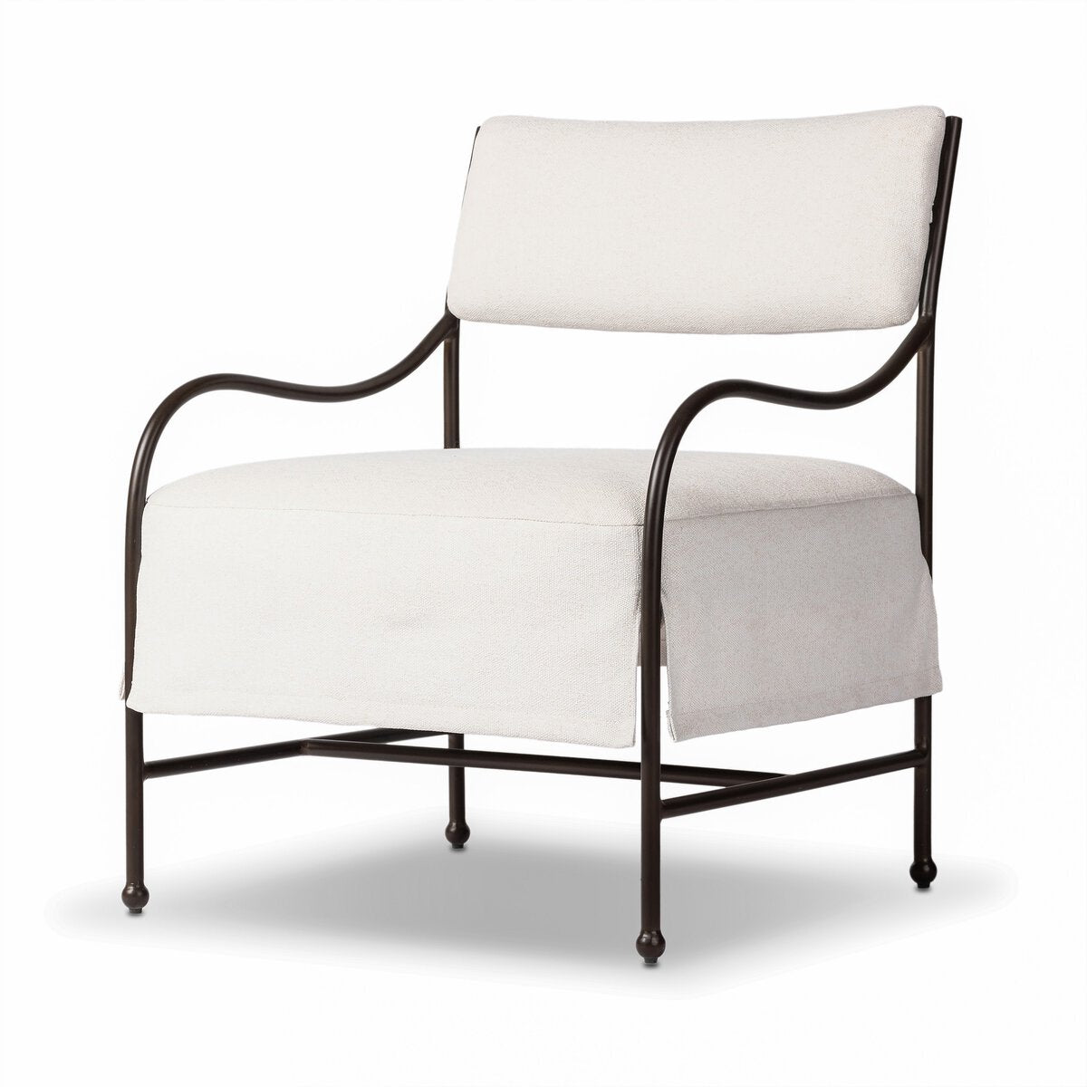 Outdoor lounge chair with curved matte gunmetal frame and handwoven linen-toned seat, styled for sculptural coastal living.