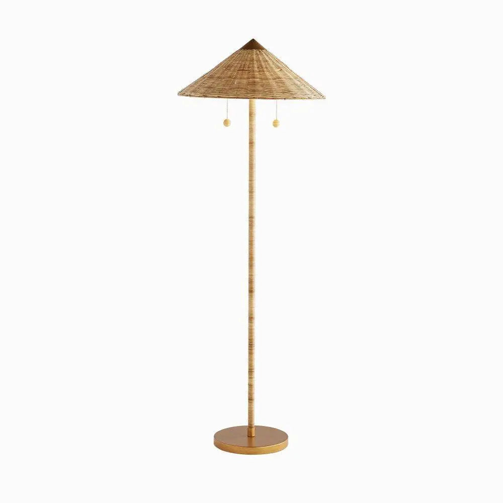 Tall rattan floor lamp with conical shade and antique brass base—coastal-inspired lighting with dual pull chains and warm, ambient glow.