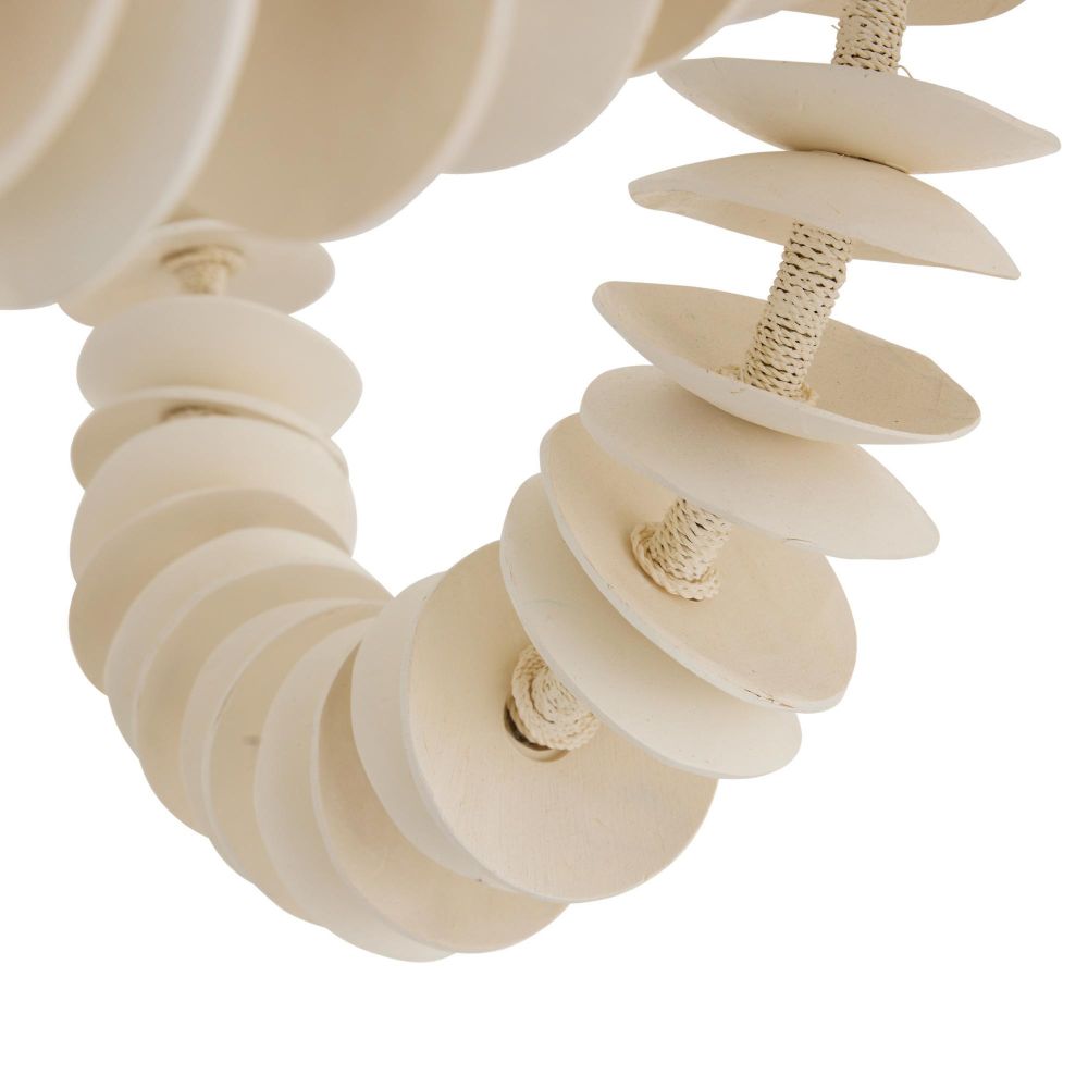 Ivory coconut shell chandelier with cascading strands and brass accents, offering sculptural coastal elegance for dining or entry spaces.
