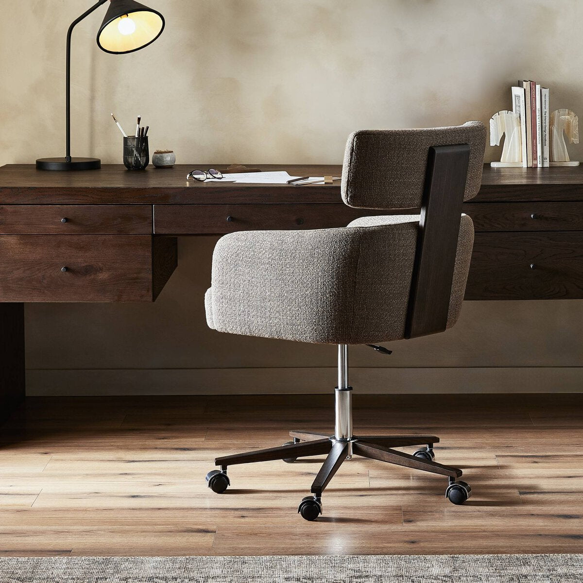 Arden Swivel Desk Chair side profile — sculptural silhouette and mink performance fabric upholstery, luxury home office seating by Rachel Blindauer