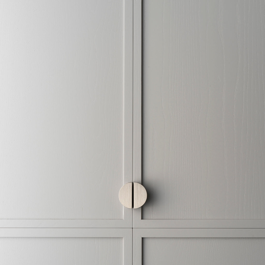 Crescent Brass Cabinet Pull installed on drawer