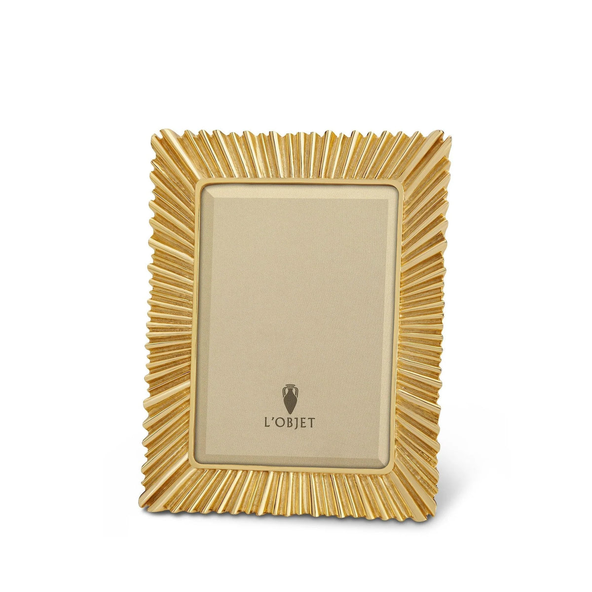 Éclat 24K gold-plated picture frame with beveled glass and suede backing, styled on a console with heirloom elegance.