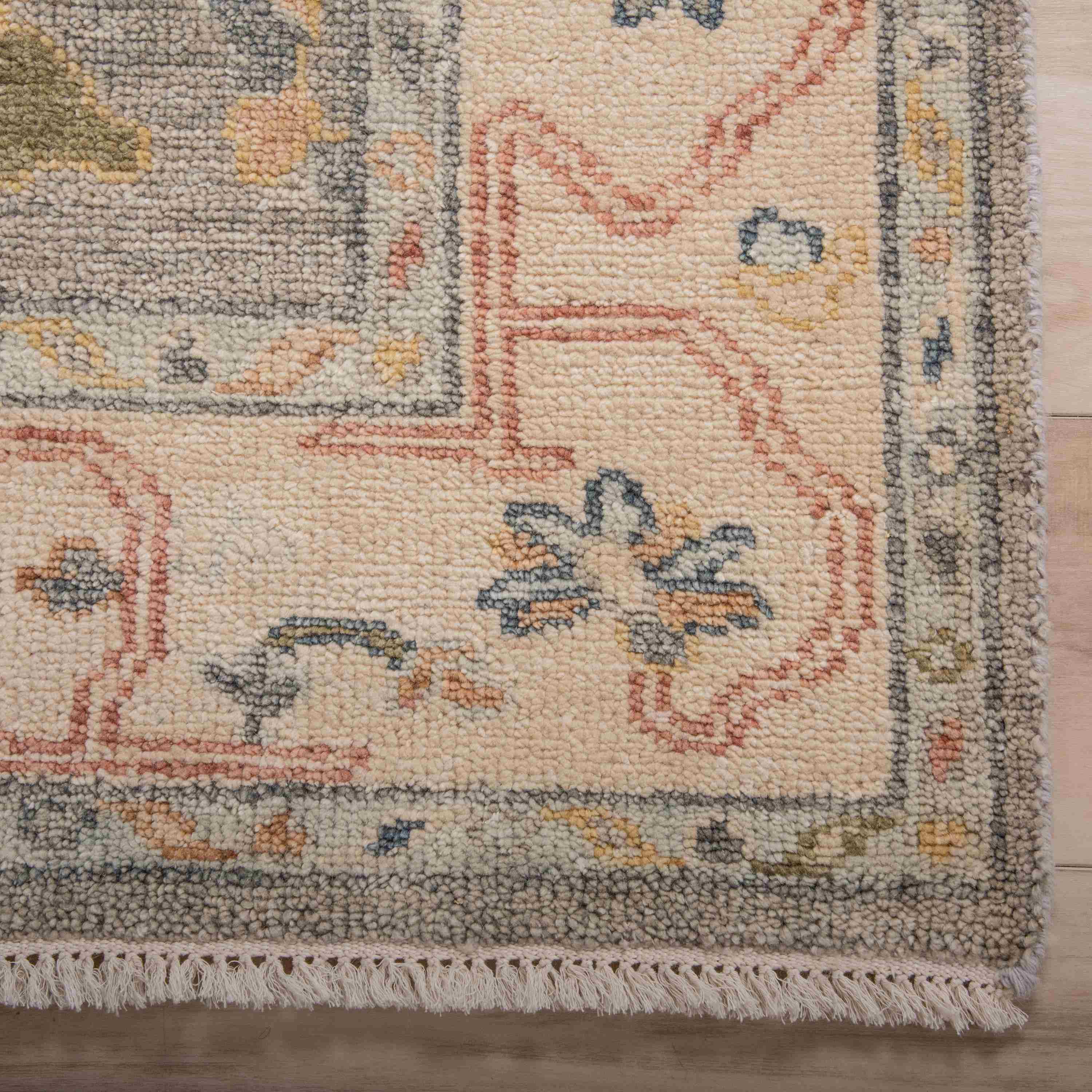 Hallmark gray hand-knotted rug styled in a living room