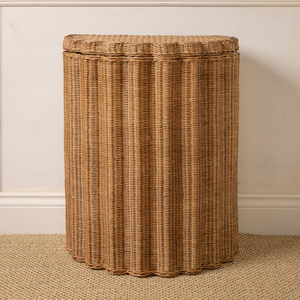 Marisol rattan basket standing against a wall