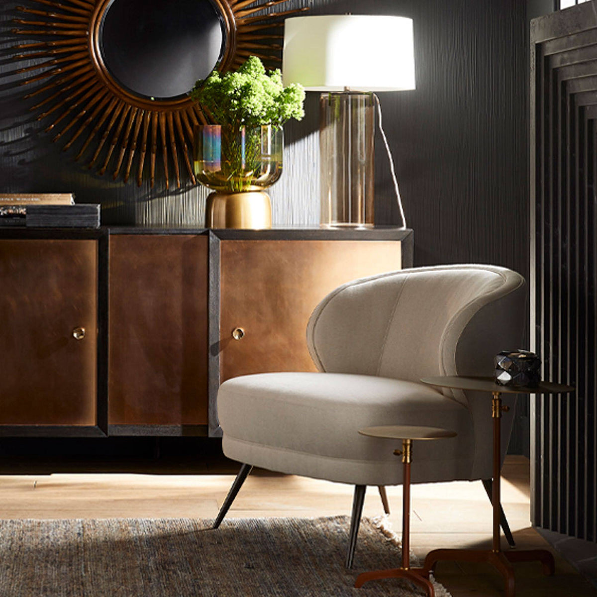 Cognac leather drink table next to a lounge chair in a moody living room