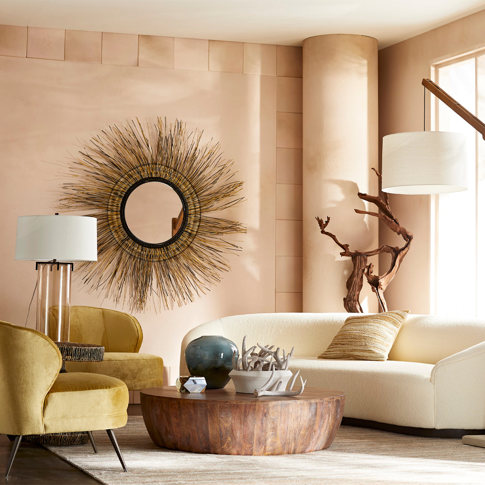 Tall driftwood root sculpture in a warm neutral living room